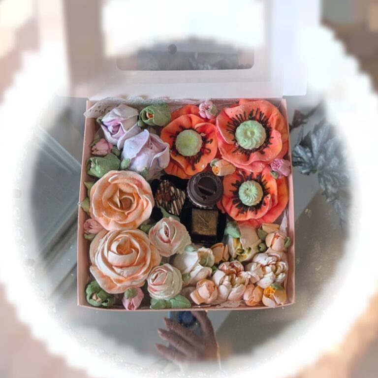 Top view of a square gift box with edible marshmallow flowers