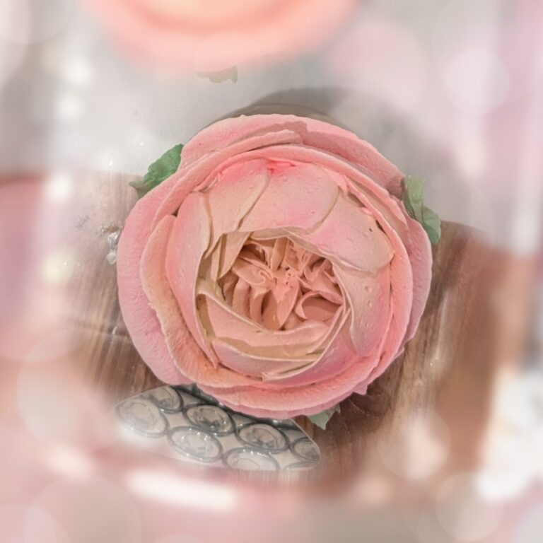 Close-up of a coral pink handmade marshmallow rose